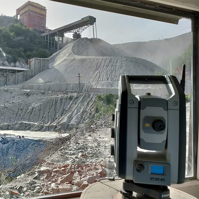 Observation station aimed at an open-air storage facility for crushed ore.